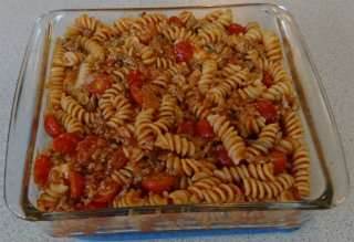 Spiral pasta with tomatoes in a 9-inch baking pan