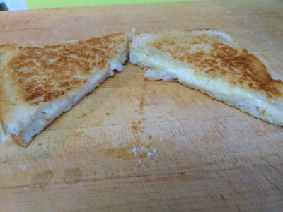 Grilled cheese sandwich cut in half