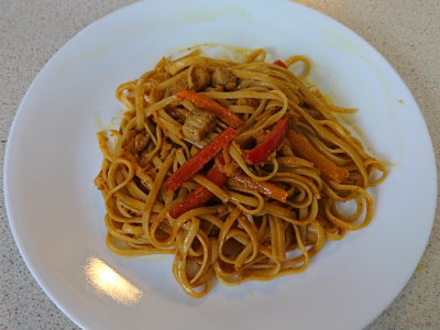 Spaghetti in a peanut butter sauce with shredded apples