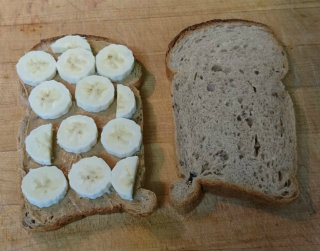 Opened sandwich with peanut butter and banana slices