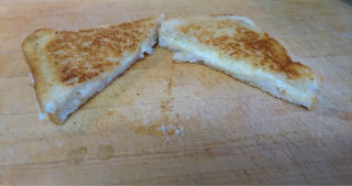 Grilled cheese cut in half