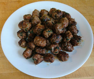 Plate piled with small meatballs